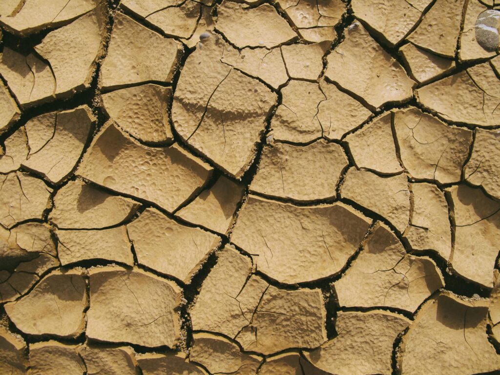Cracked earth texture symbolizing low humidity and water loss